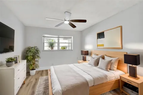 a view of a room with wooden floor