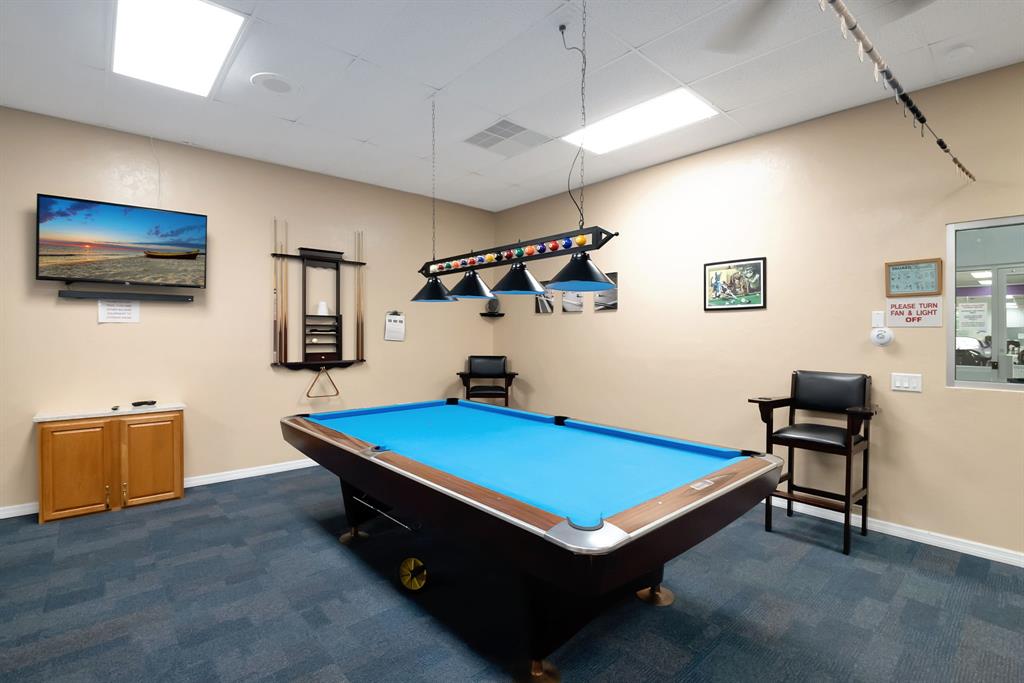 300 Southwest Golfview Terrace, Unit 131 Boynton Beach, FL 33426 - Photo 51 of 57 a room with pool table and a flat screen tv