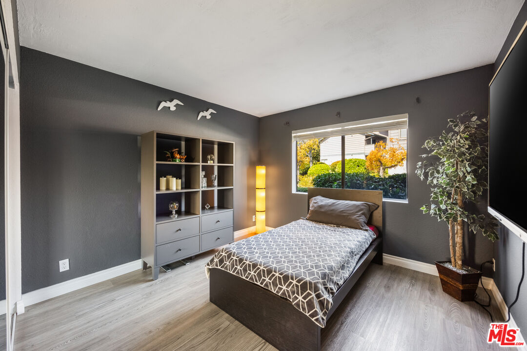 2963 Alwood Court Spring Valley, CA 91978 - Photo 13 of 20 a room with a bed and wooden floor