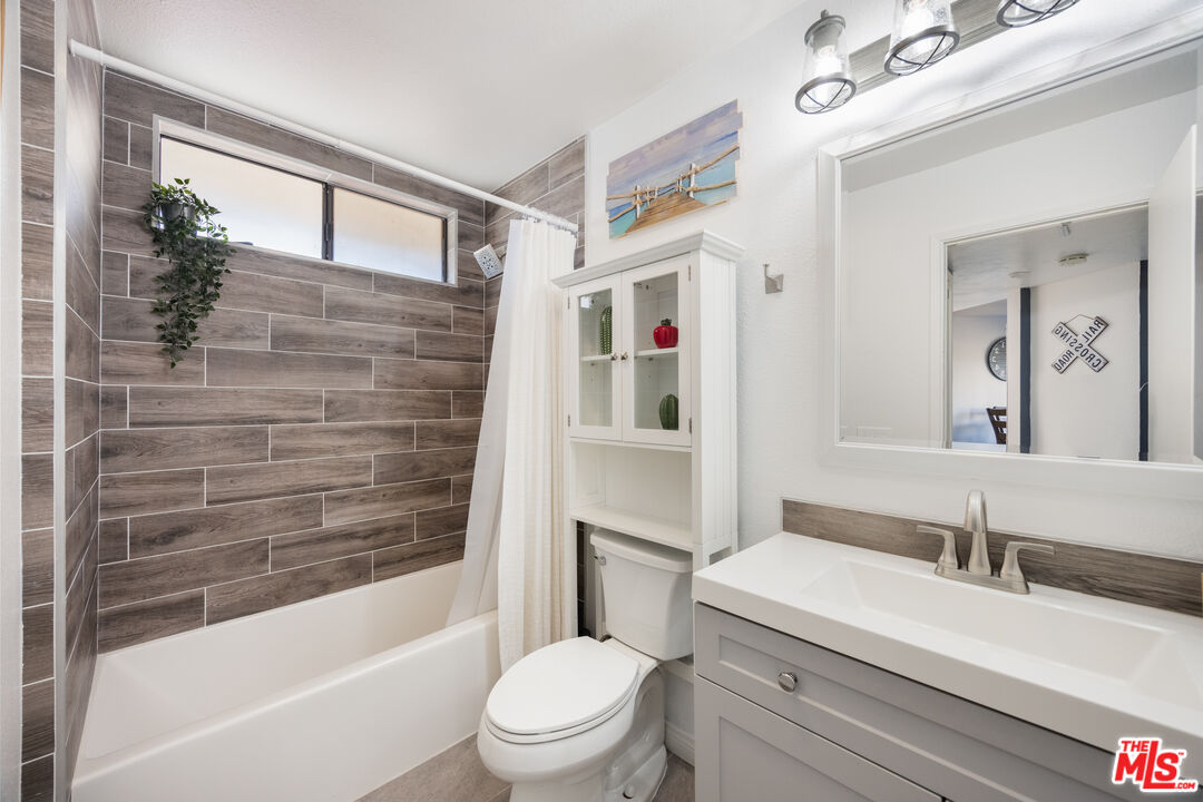 2963 Alwood Court Spring Valley, CA 91978 - Photo 15 of 20 a bathroom with a sink a toilet and shower