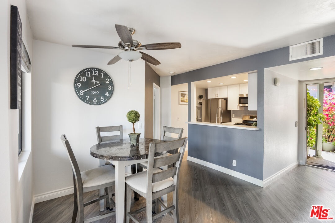 2963 Alwood Court Spring Valley, CA 91978 - Photo 4 of 20 a view of a dining room with furniture and wooden floor