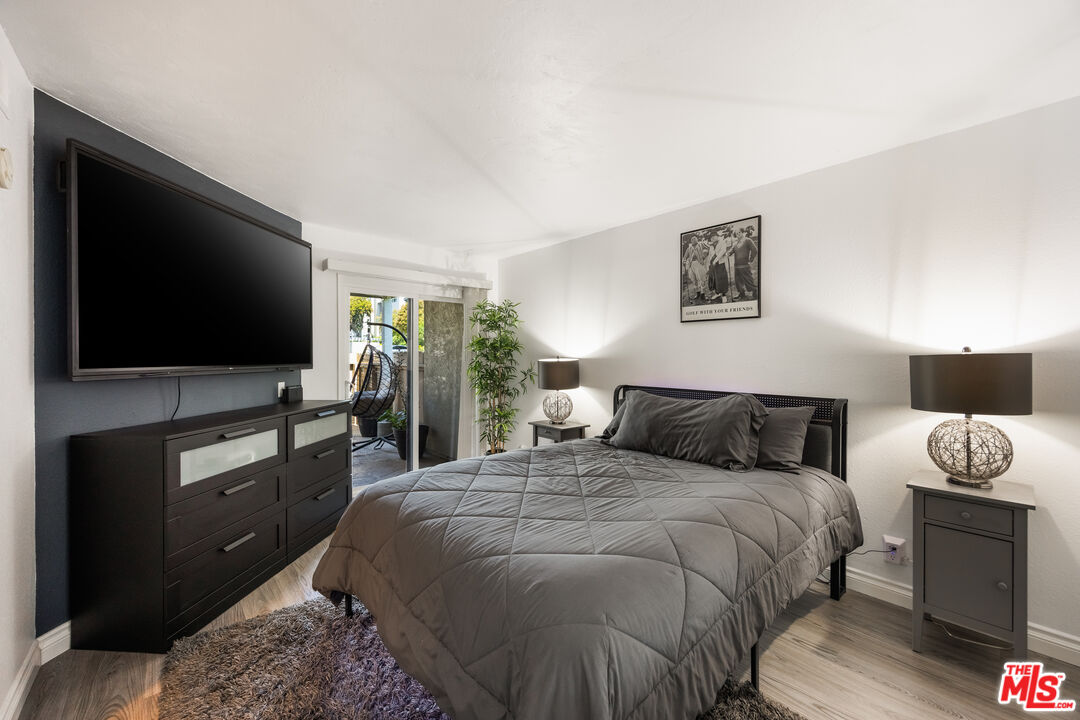 2963 Alwood Court Spring Valley, CA 91978 - Photo 9 of 20 a bedroom with a bed and a flat screen tv