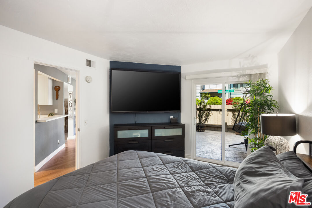 2963 Alwood Court Spring Valley, CA 91978 - Photo 10 of 20 a bedroom with a bed and a flat screen tv