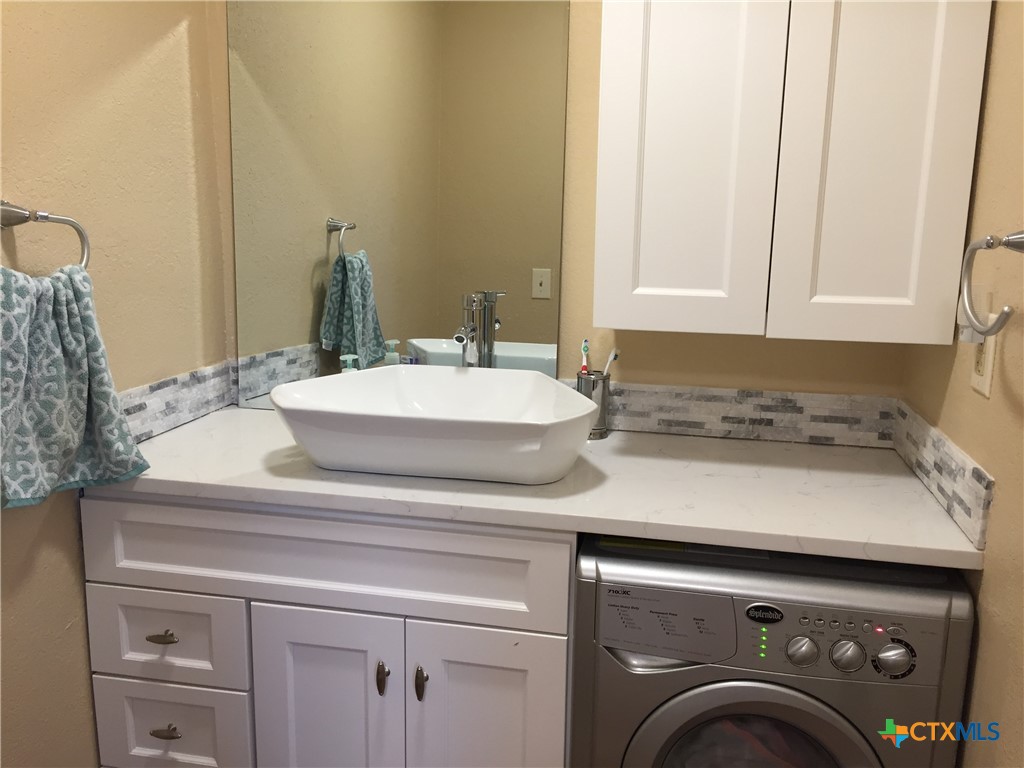4841 Highway 35, Unit 203 Rockport, TX 78382 - Photo 11 of 23 a utility room with dryer and washer