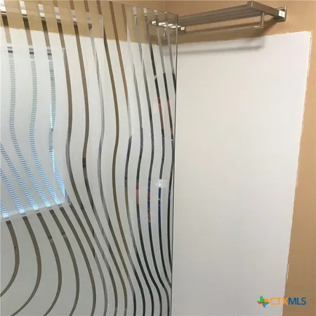 a kitchen with stainless steel appliances a refrigerator and wooden floor