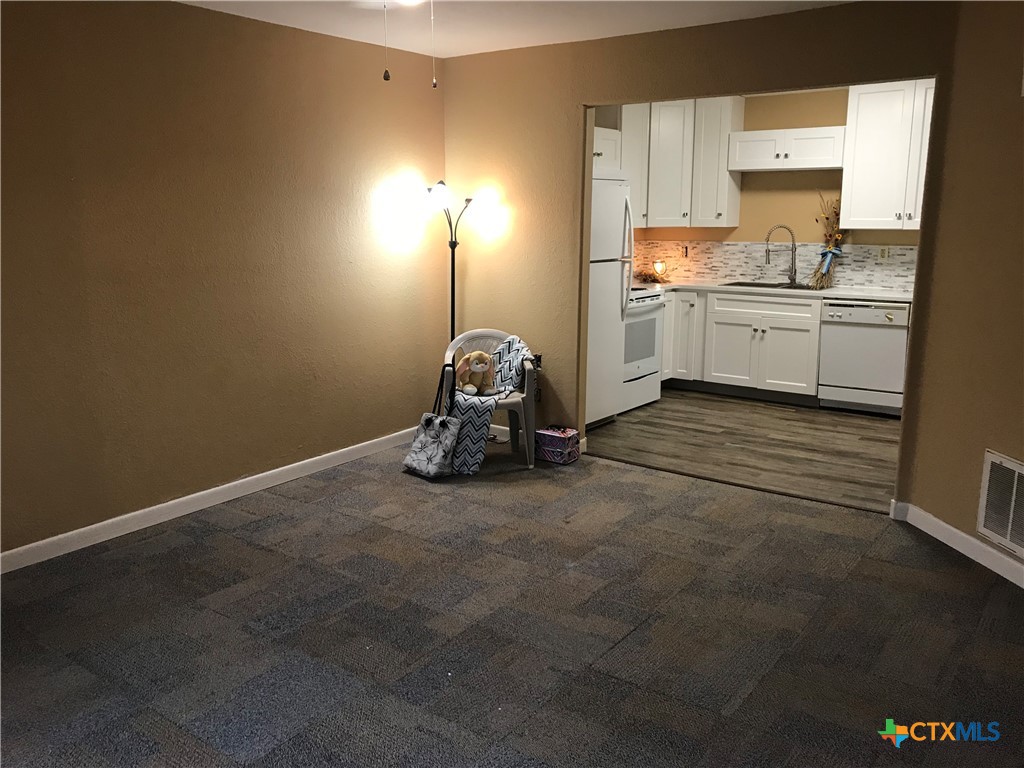 4841 Highway 35, Unit 203 Rockport, TX 78382 - Photo 23 of 23 a kitchen with a sink and cabinets