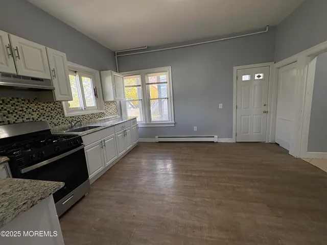 a view of empty room with windows