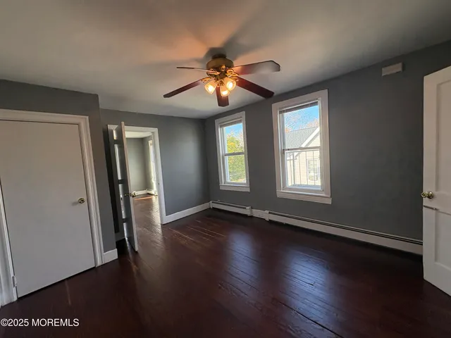 a view of a hardwood & staircase in a room