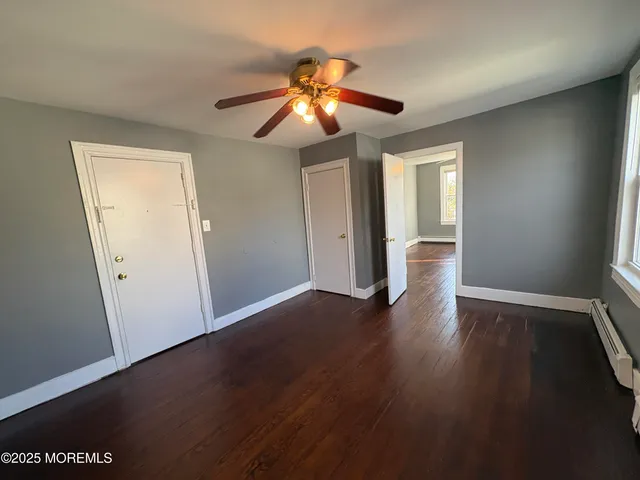 a view of an empty room with stairs