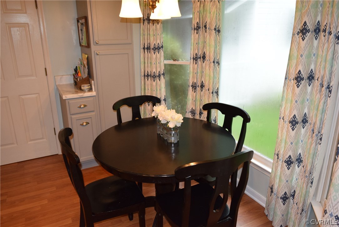 12212 2nd Branch Road Chesterfield, VA 23838 - Photo 23 of 34 a view of a dining room with furniture and wooden floor