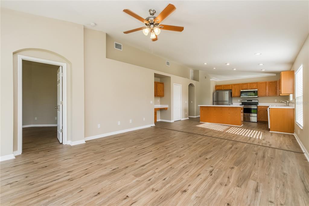 17326 Poppy Fields Lane Land O Lakes, FL 34638 - Photo 4 of 15 a view of a kitchen with a sink and a refrigerator