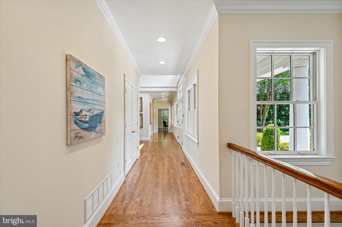 2700 Falling Timber Trail Edgewater, MD 21037 - Photo 24 of 89 a view of a hallway with wooden floor and windows