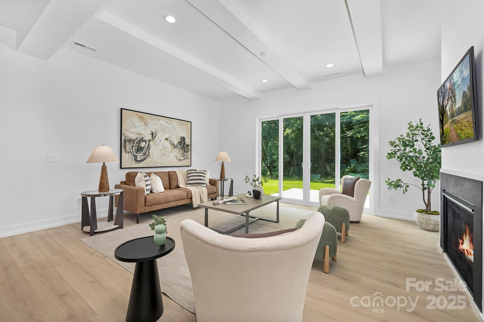 511 Bowman Road Charlotte, NC 28217 - Photo 5 of 21 a living room with furniture and a large window