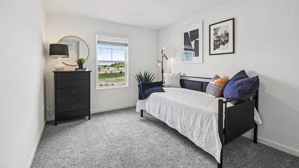 a bed room with a bed and a window