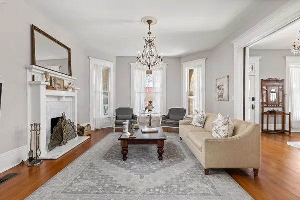 a living room with furniture fireplace and window