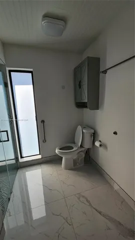 a bathroom with double vanity sink and two mirror