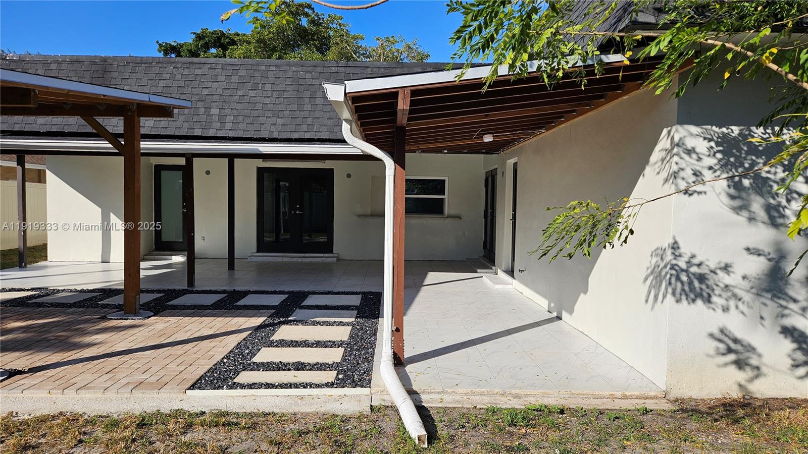 8004 Southwest 29th Street Davie, FL 33328 - Photo 25 of 39 a front view of a house with a yard