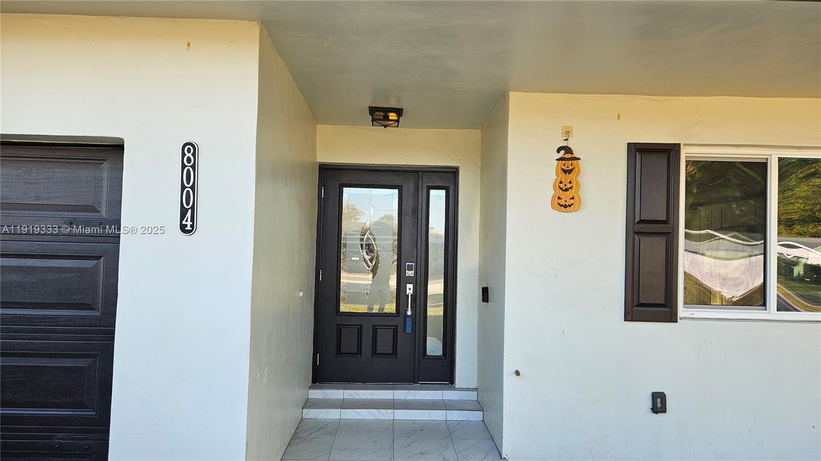 8004 Southwest 29th Street Davie, FL 33328 - Photo 3 of 39 a view of an entryway of the house