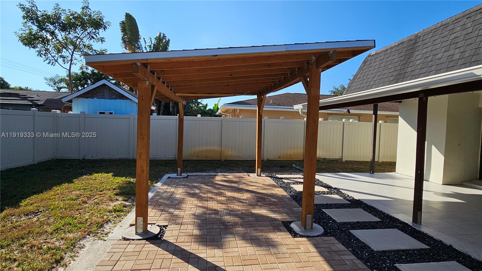 8004 Southwest 29th Street Davie, FL 33328 - Photo 32 of 39 a patio with table and chairs