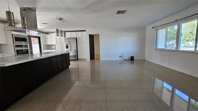 a view of a kitchen with a sink