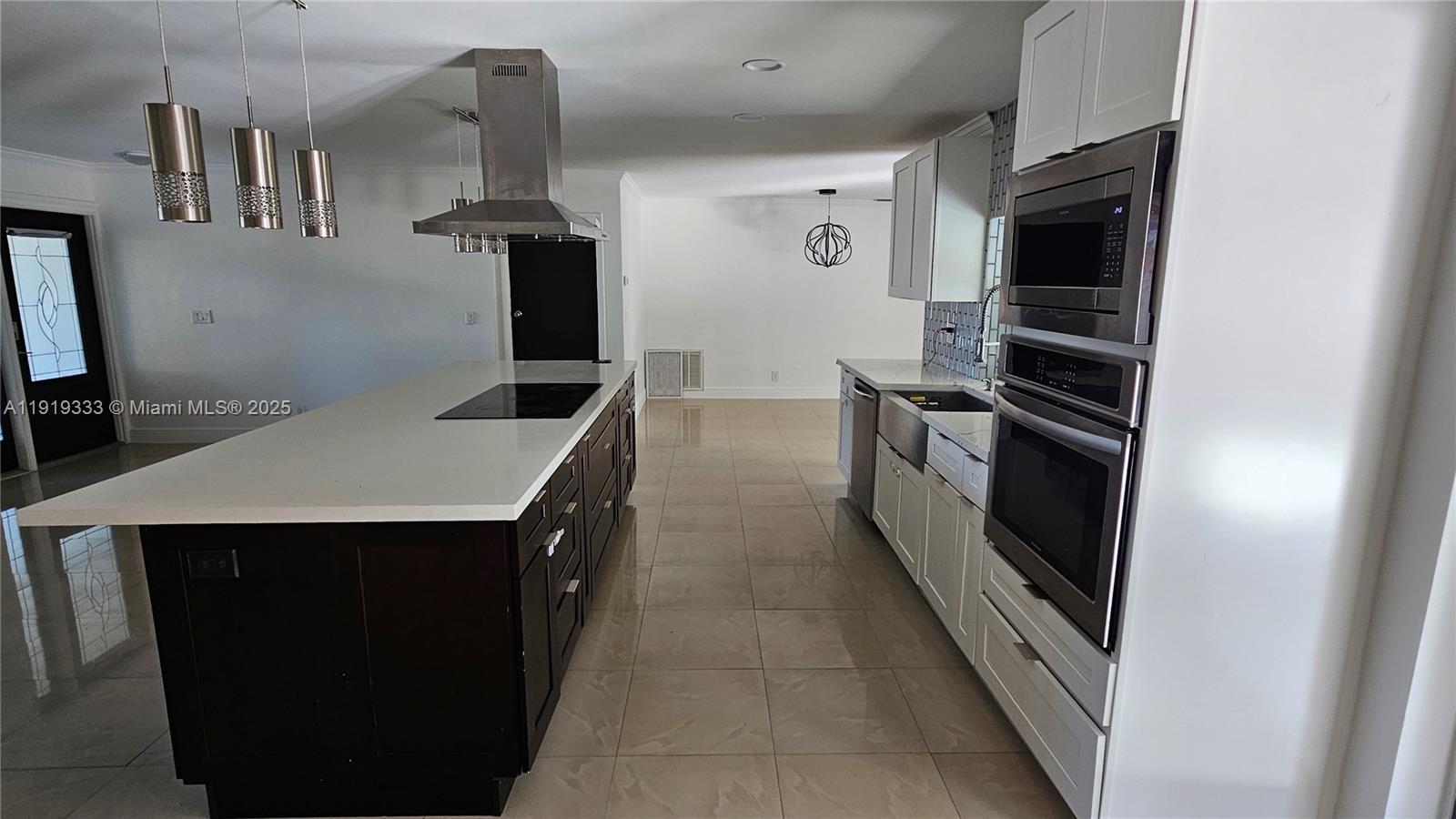 8004 Southwest 29th Street Davie, FL 33328 - Photo 7 of 39 a kitchen with stainless steel appliances a stove and a refrigerator