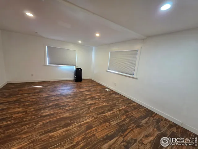 a bathroom with a toilet a sink and a mirror