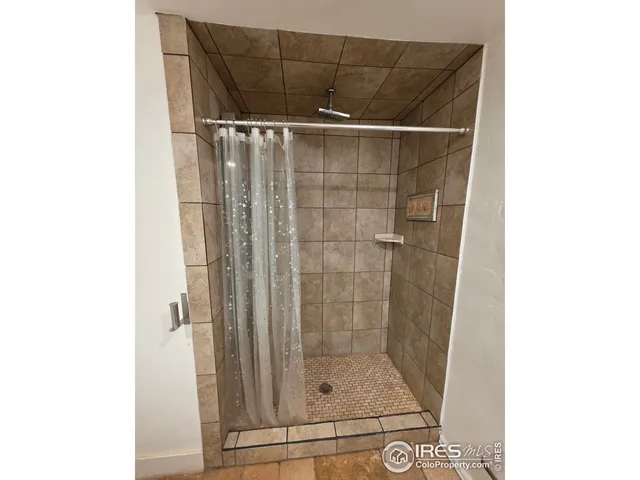 a bathroom with a double vanity sink and mirror