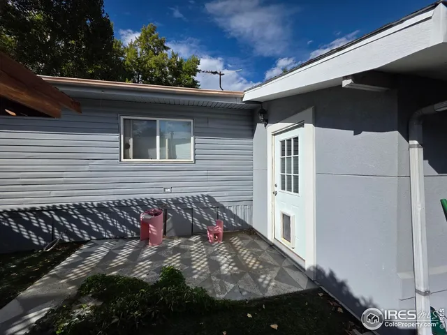 a view of a house with a small yard