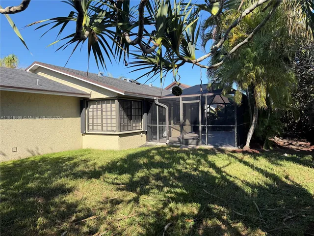 a front view of a house with swimming pool and porch
