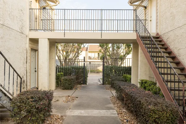 a view of a house with a street