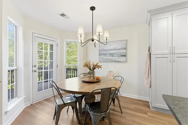 a view of a dining room with furniture window and outside view
