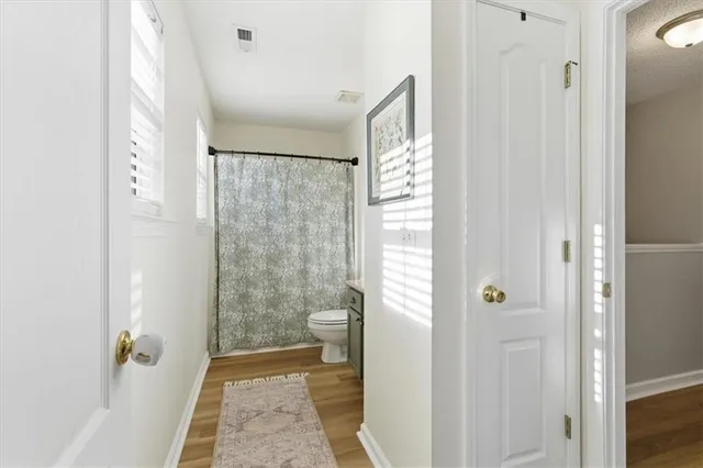 a bathroom with a shower and a sink