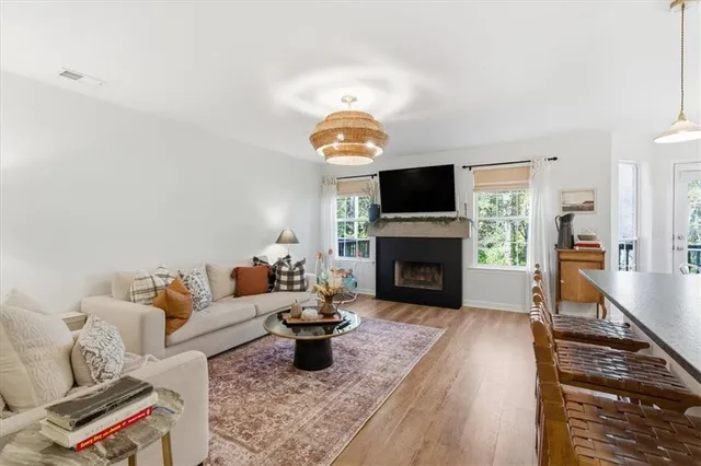 a living room with furniture fireplace and a flat screen tv