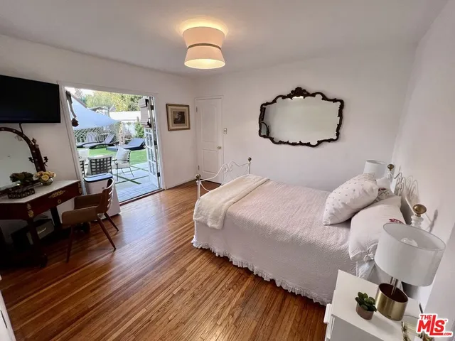 a bedroom with bed and window
