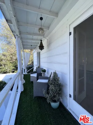 a view of a porch with furniture