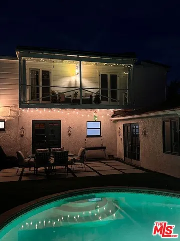 a view of swimming pool from a balcony