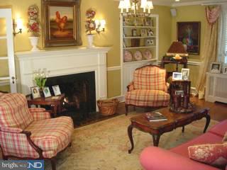 15 Farm Road Wayne, PA 19087 - Photo 2 of 6 a living room with furniture and a fireplace