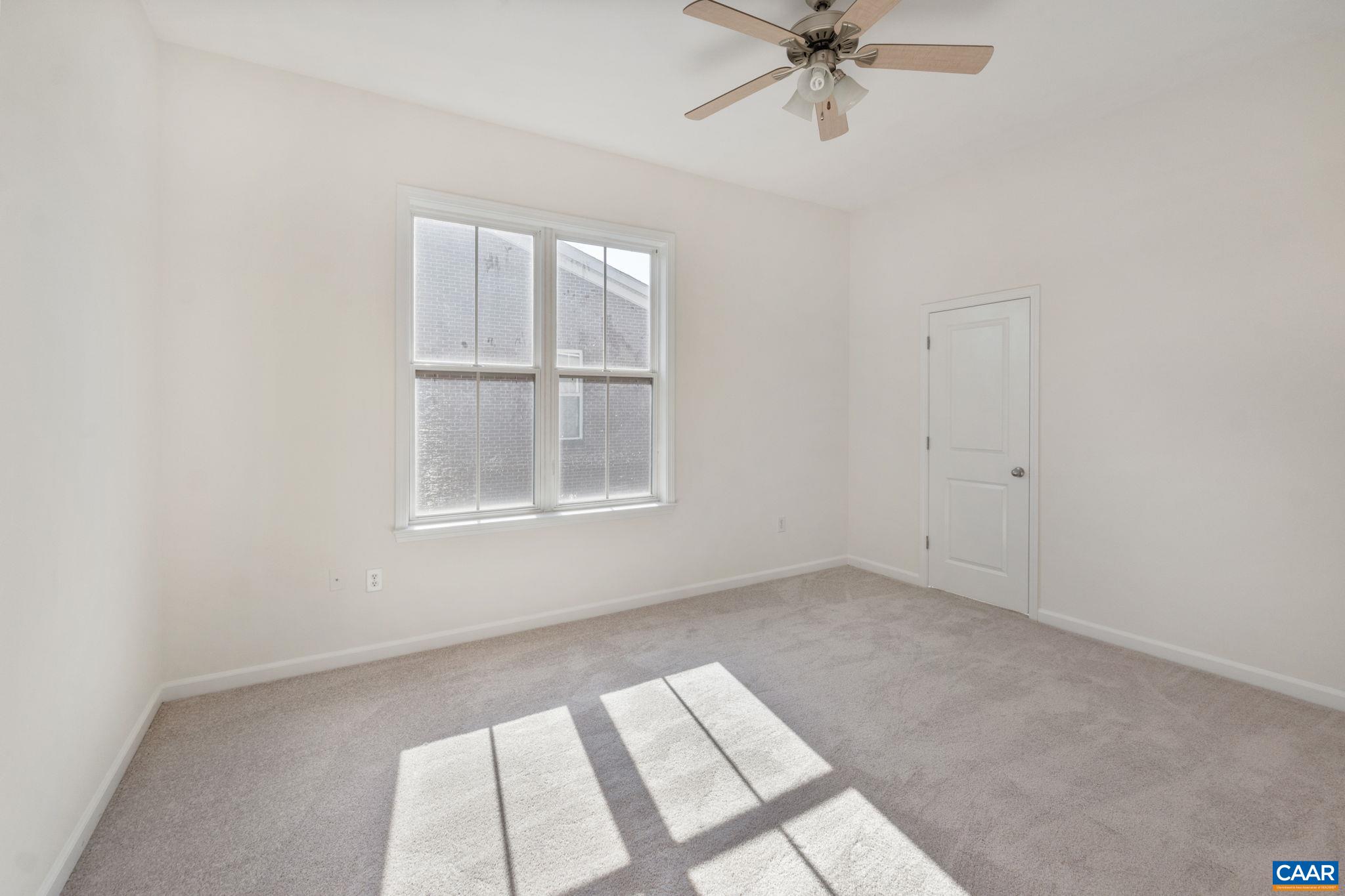 765 Walker Square, Unit 4B Charlottesville, VA 22903 - Photo 15 of 17 an empty room with a window