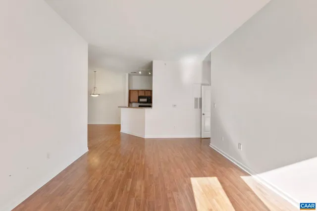 a view of a kitchen with wooden floor