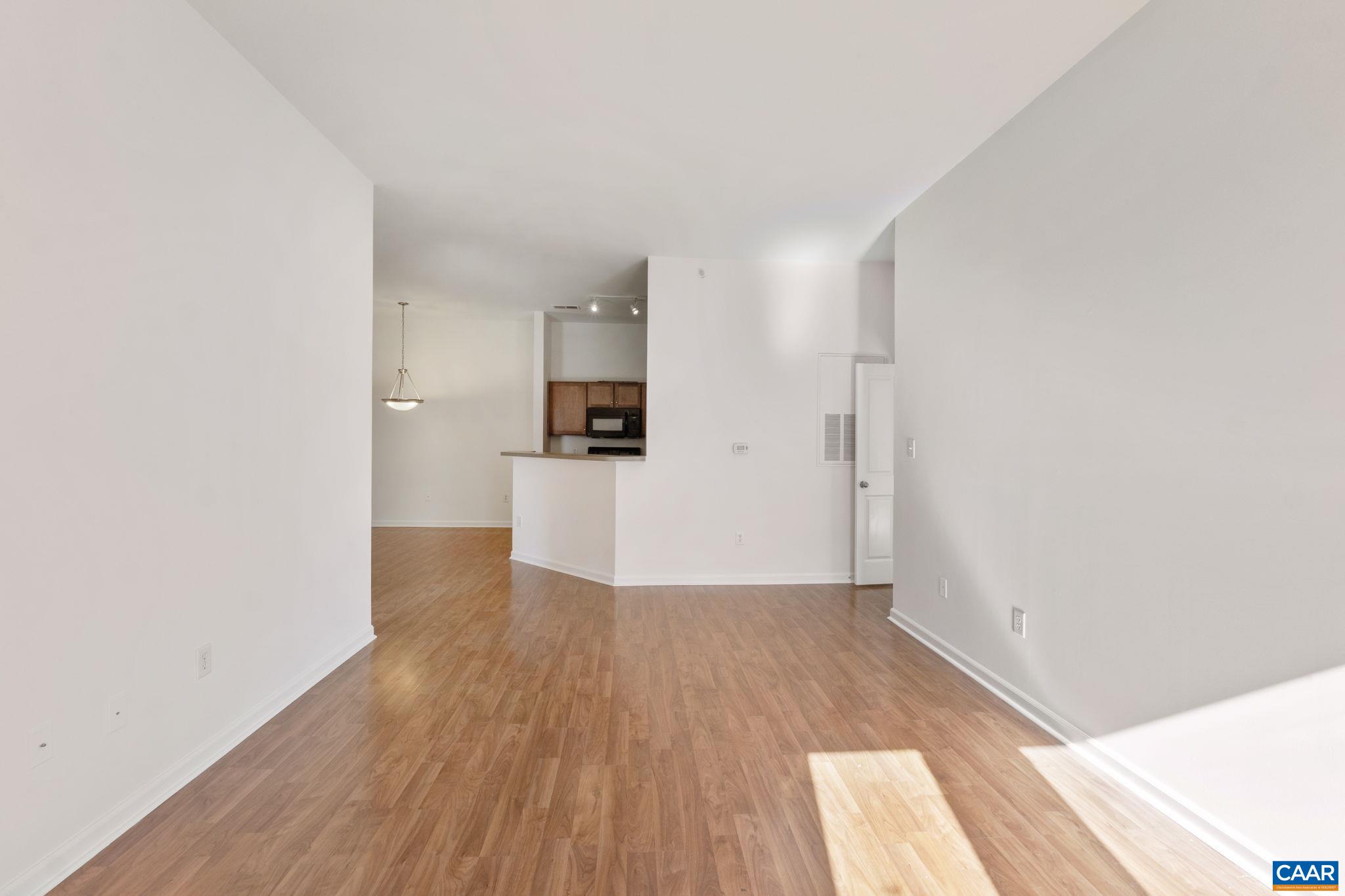 765 Walker Square, Unit 4B Charlottesville, VA 22903 - Photo 6 of 17 a view of a kitchen with wooden floor