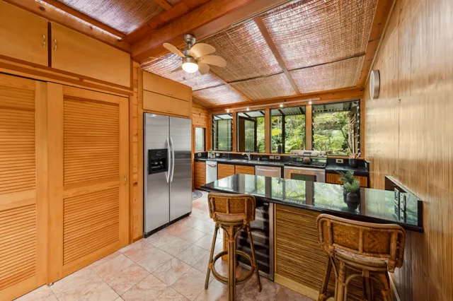 a view of a house with a large window and wooden floor