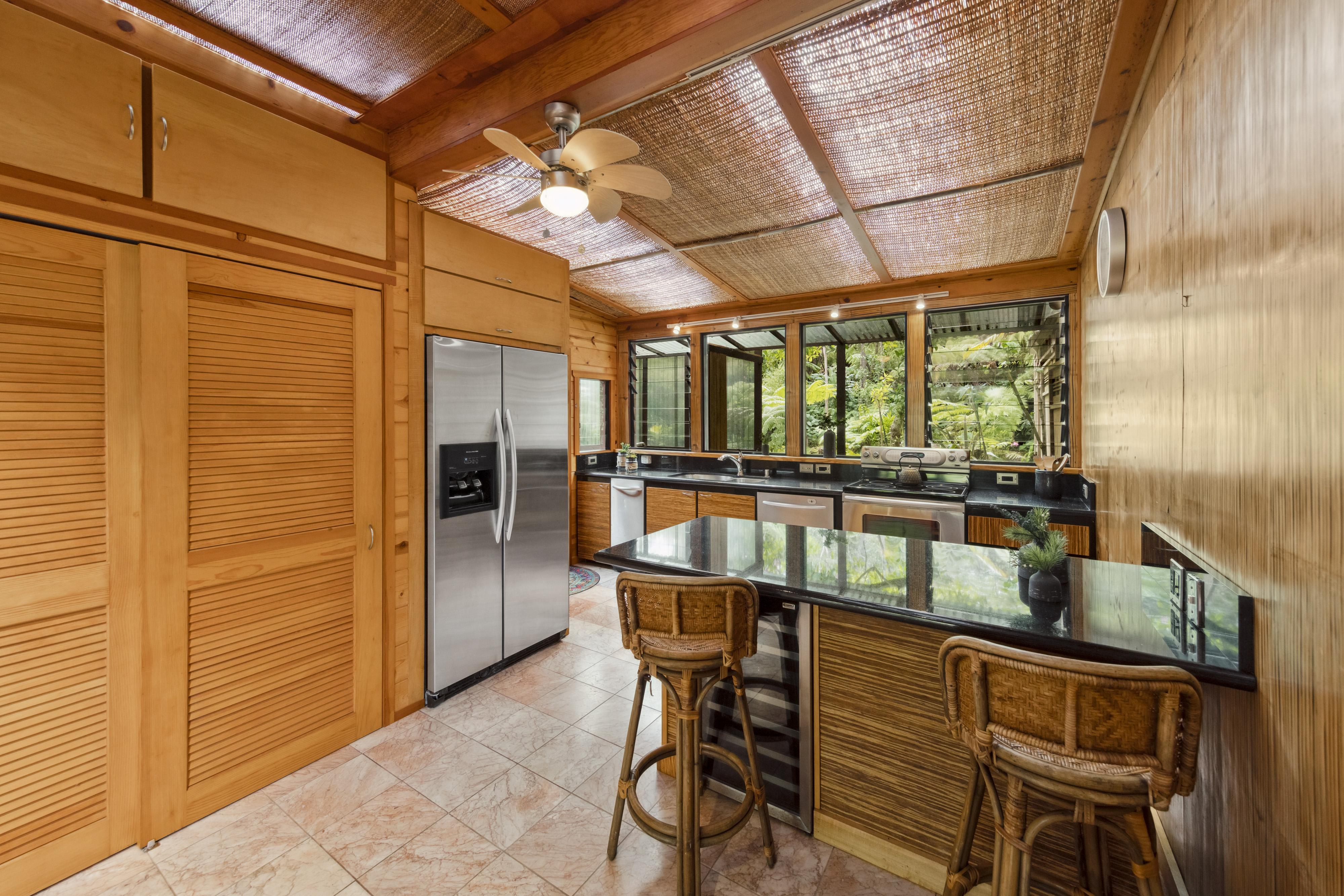 19-4245 Kekoa Nui Boulevard Volcano, HI 96785 - Photo 11 of 30 a view of a chairs and table in the balcony