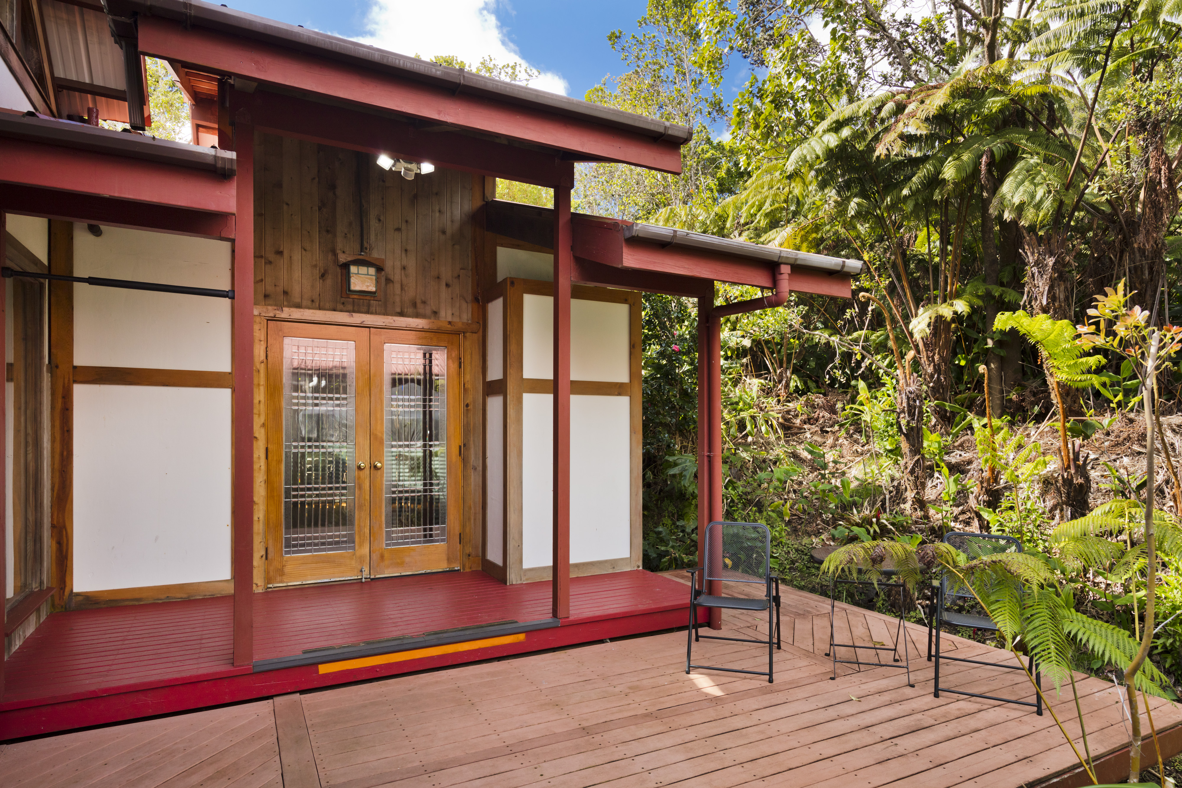 19-4245 Kekoa Nui Boulevard Volcano, HI 96785 - Photo 12 of 30 a view of a house with a large window and wooden floor