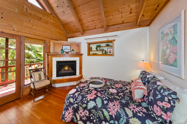 a bedroom with furniture and a wooden floor