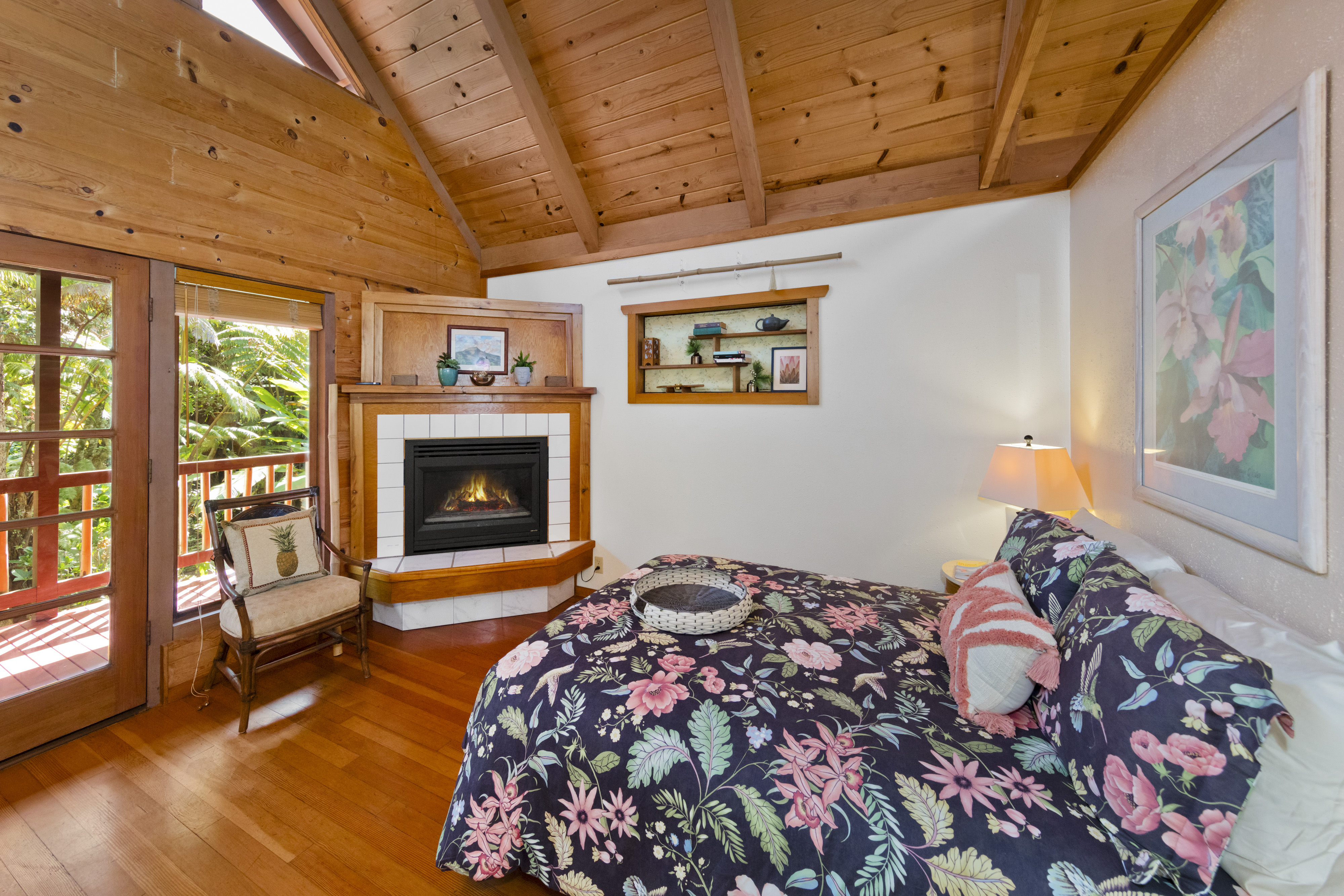 19-4245 Kekoa Nui Boulevard Volcano, HI 96785 - Photo 18 of 30 a bedroom with a bed and a fireplace