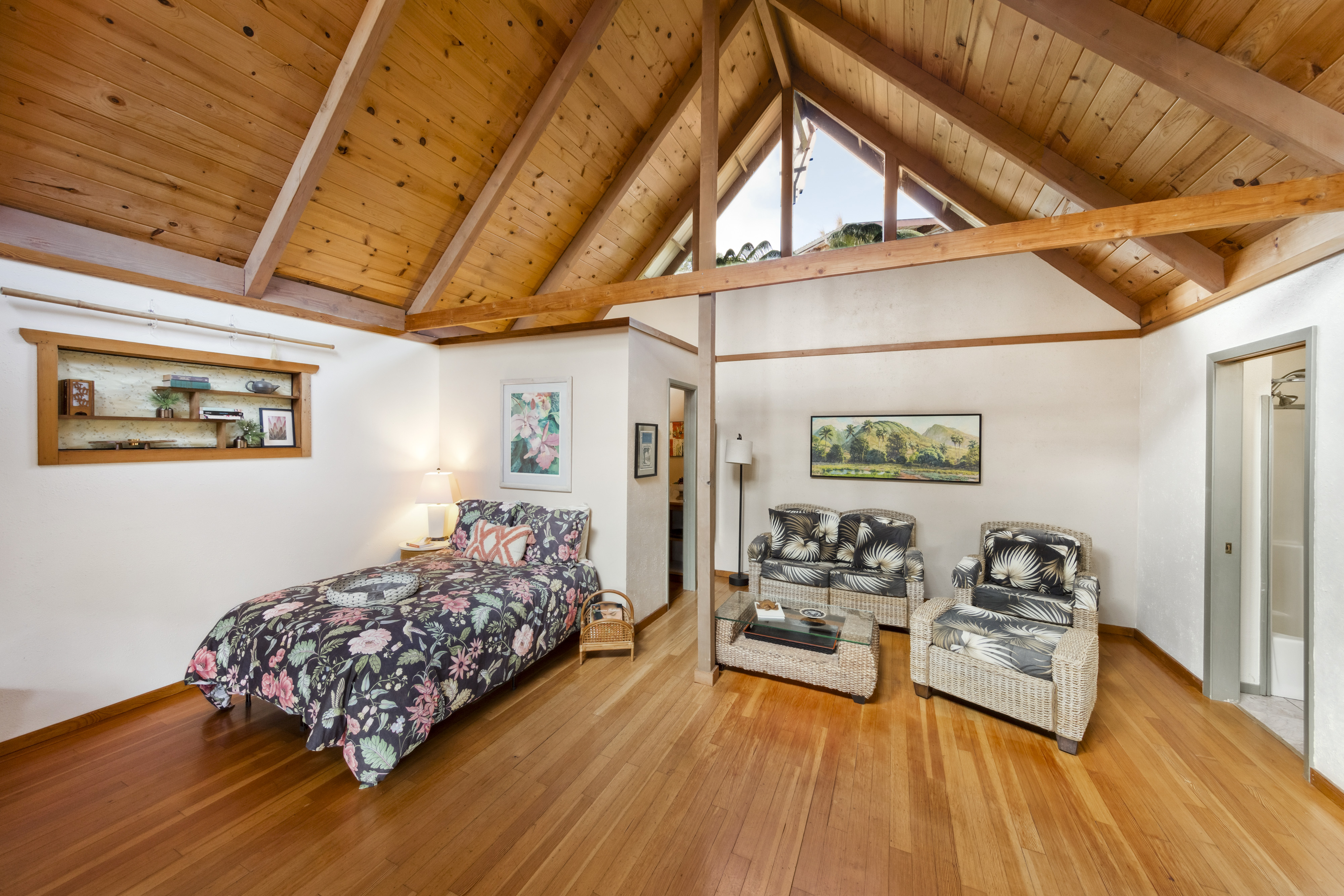 19-4245 Kekoa Nui Boulevard Volcano, HI 96785 - Photo 19 of 30 a bedroom with furniture and a wooden floor