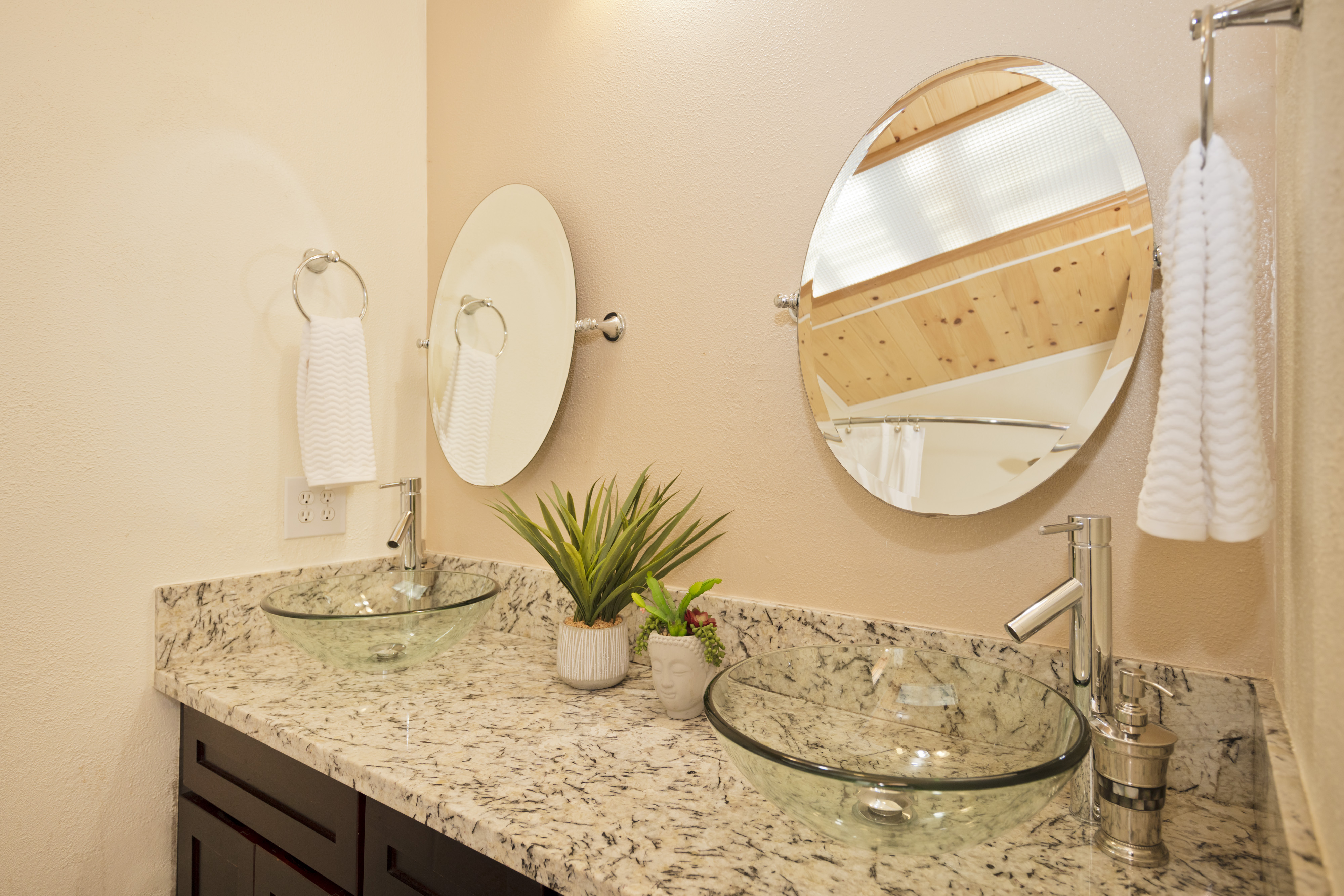 19-4245 Kekoa Nui Boulevard Volcano, HI 96785 - Photo 21 of 30 a bathroom with a granite countertop sink and a mirror