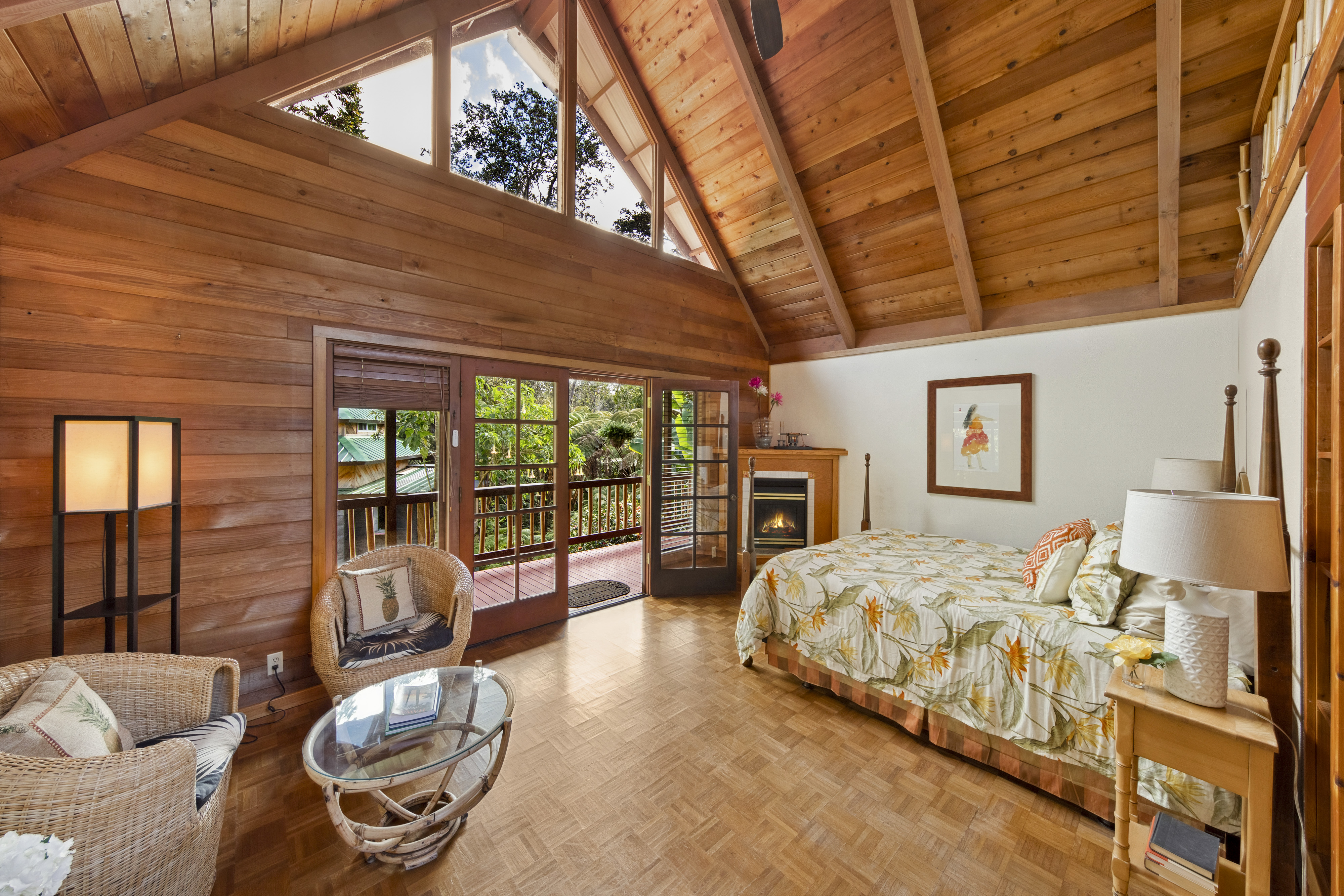 19-4245 Kekoa Nui Boulevard Volcano, HI 96785 - Photo 23 of 30 a bedroom with bed and balcony