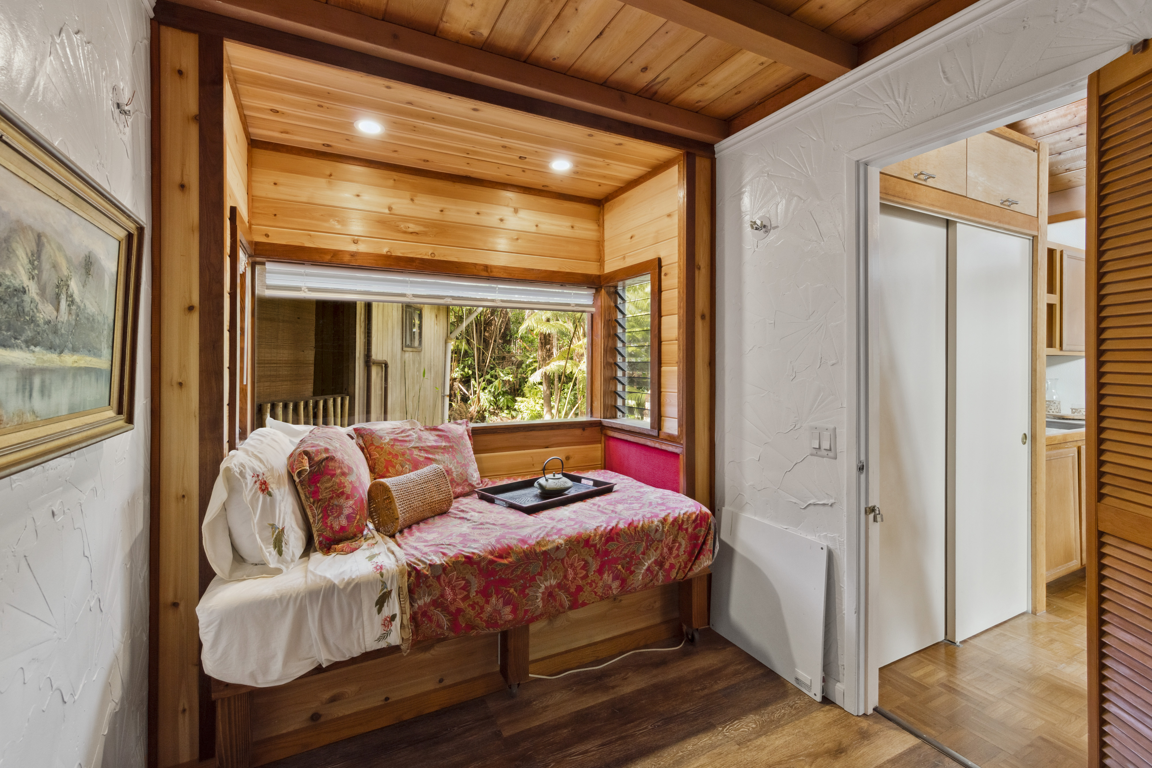 19-4245 Kekoa Nui Boulevard Volcano, HI 96785 - Photo 26 of 30 a bedroom with furniture and a window
