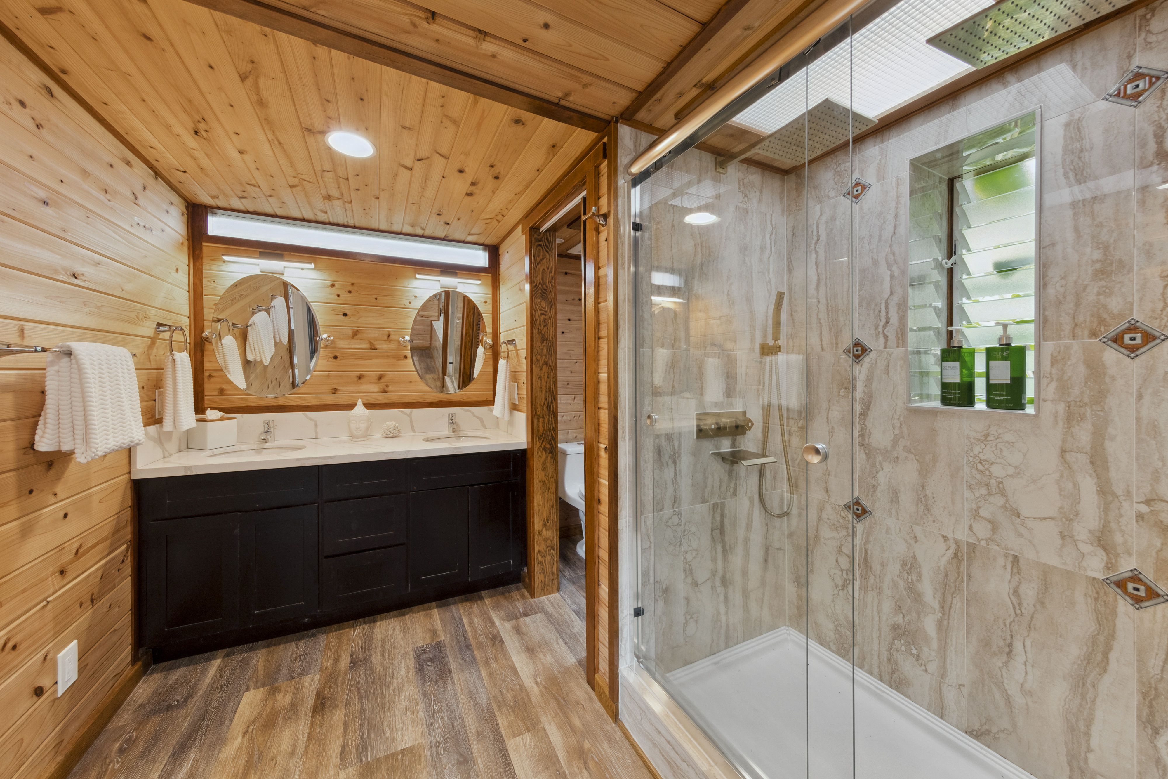 19-4245 Kekoa Nui Boulevard Volcano, HI 96785 - Photo 28 of 30 a bathroom with a bathtub and a shower